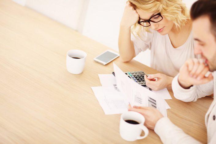 Adult couple working on documents